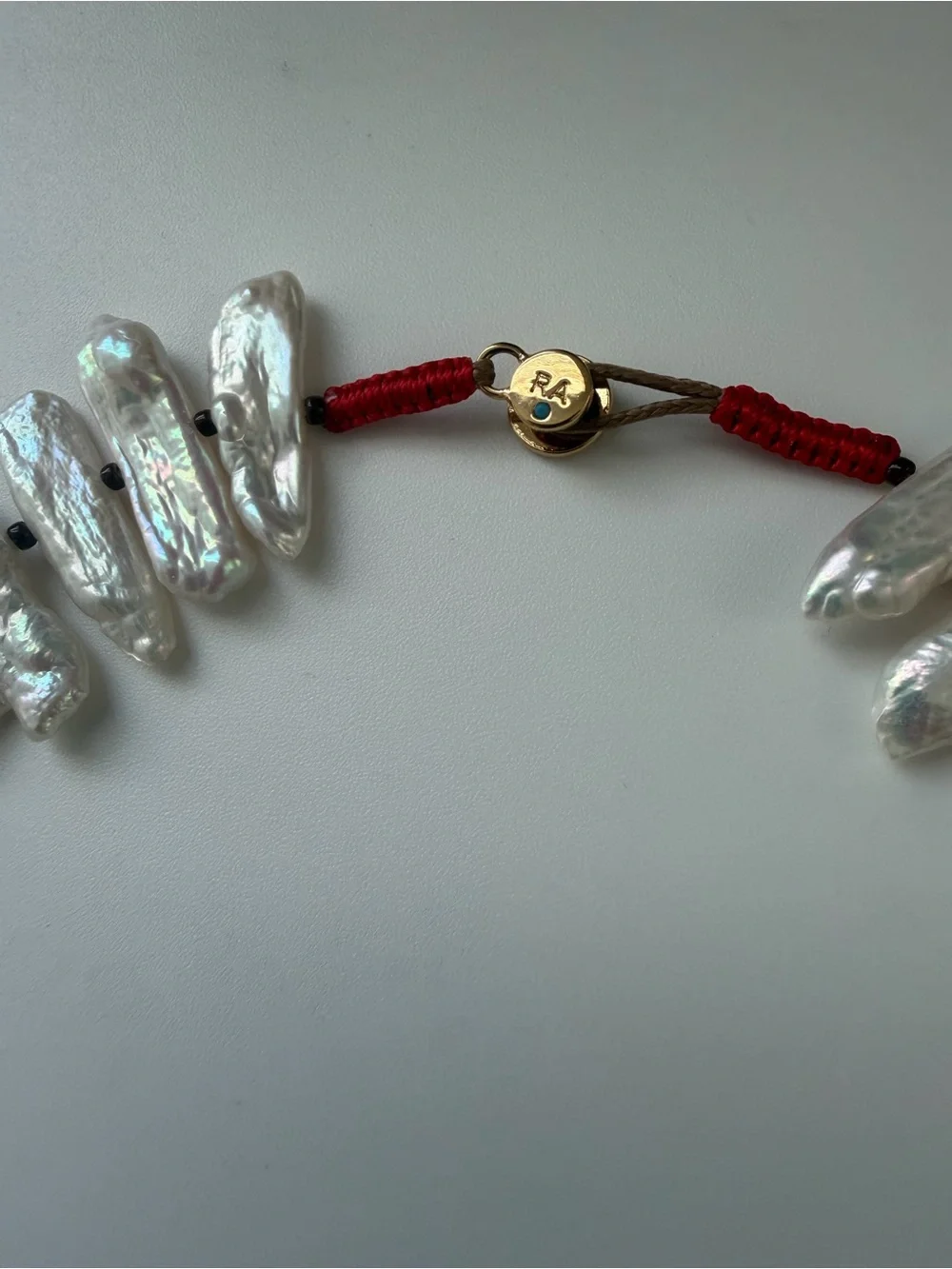 NWOT Roxanne Assoulin White Pearl Spike and Gold Charm Layered Necklace